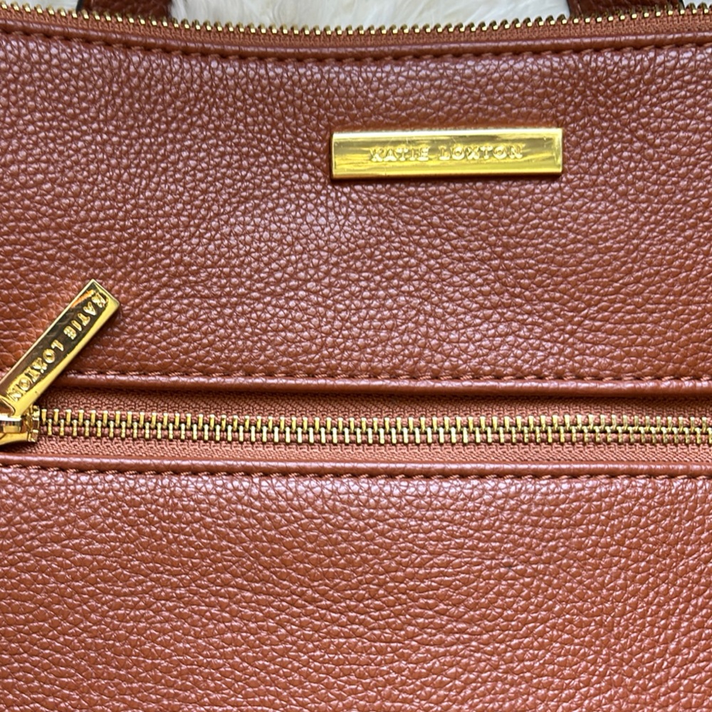 Luxurious Brown Leather Backpack with Gold Zippers
